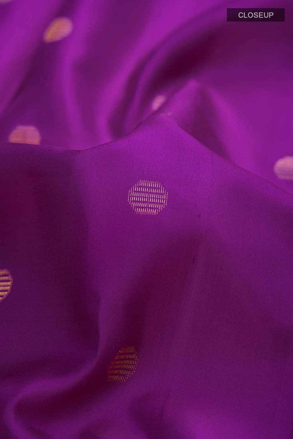 Close up of Violet Soft Silk Saree with Zari Butta on the body and Zari Border displaying folds