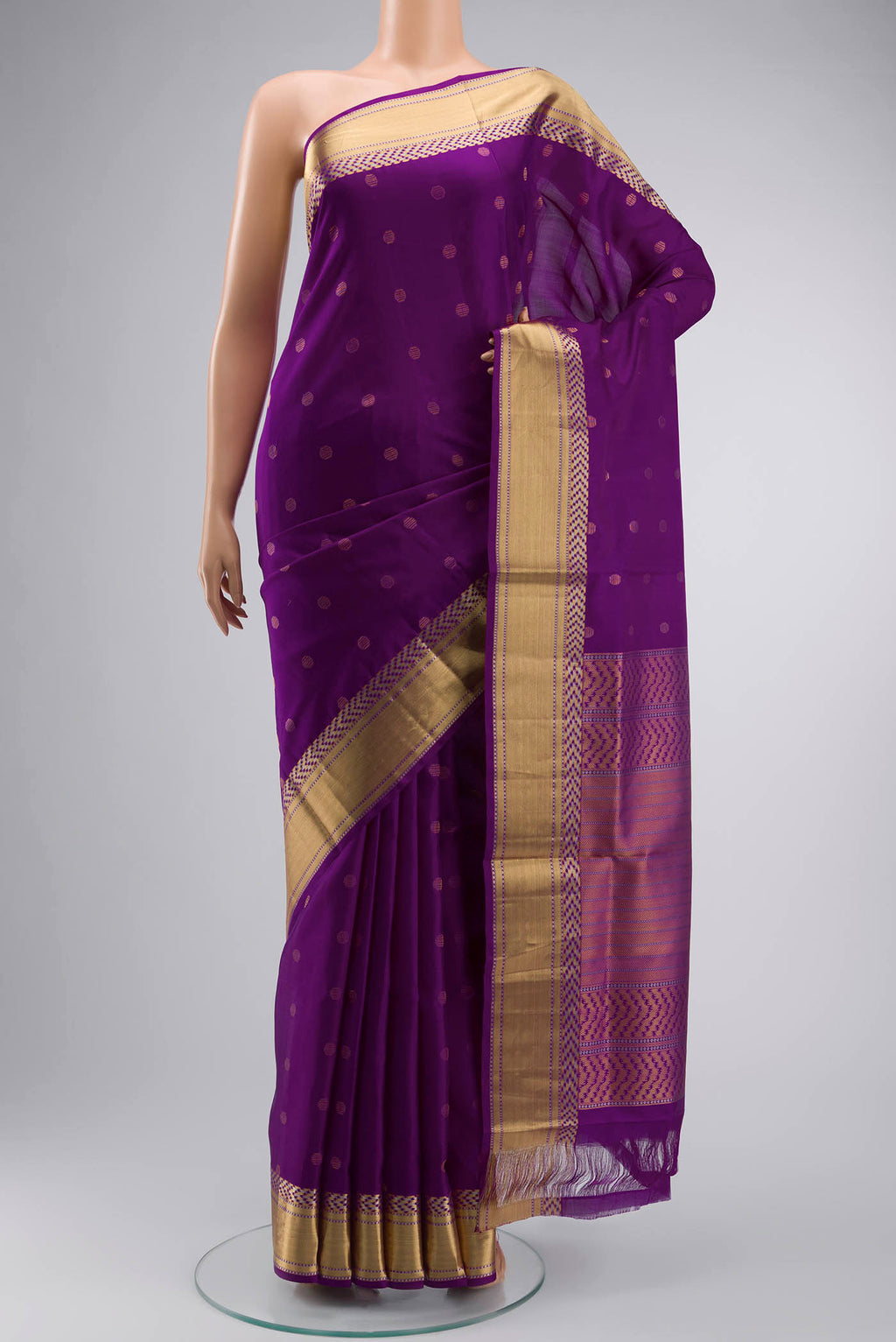 Violet Soft Silk Saree with Zari Butta on the body and Zari Border displayed on a mannequin