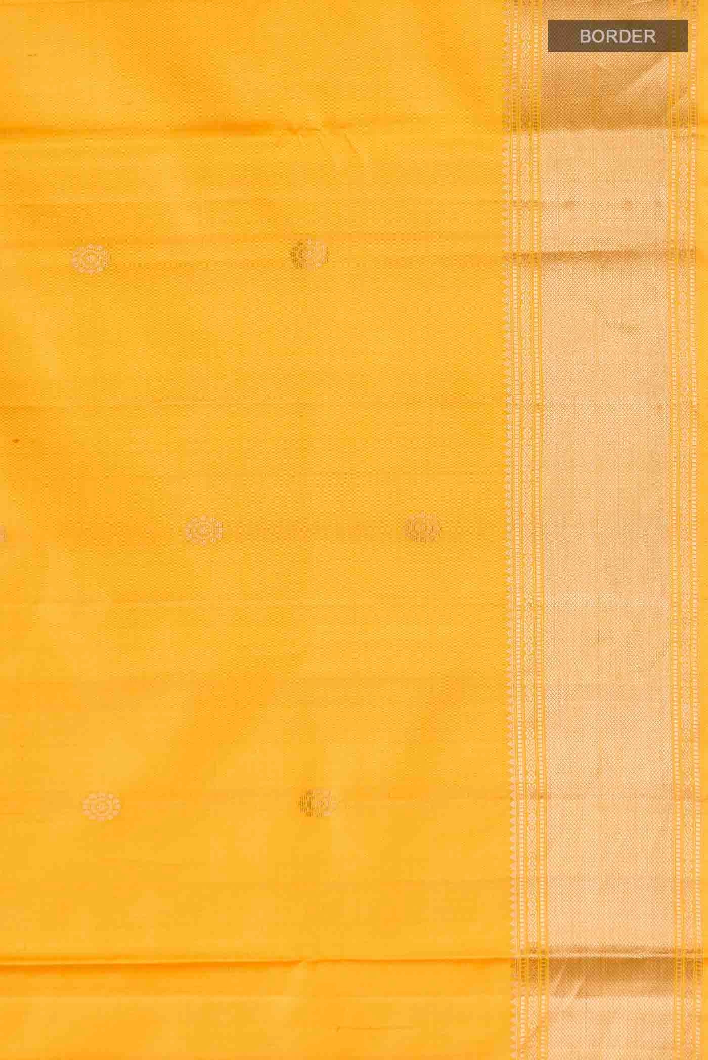 Border image of Yellow Soft Silk Saree with Zari Butta on the body and Zari Border