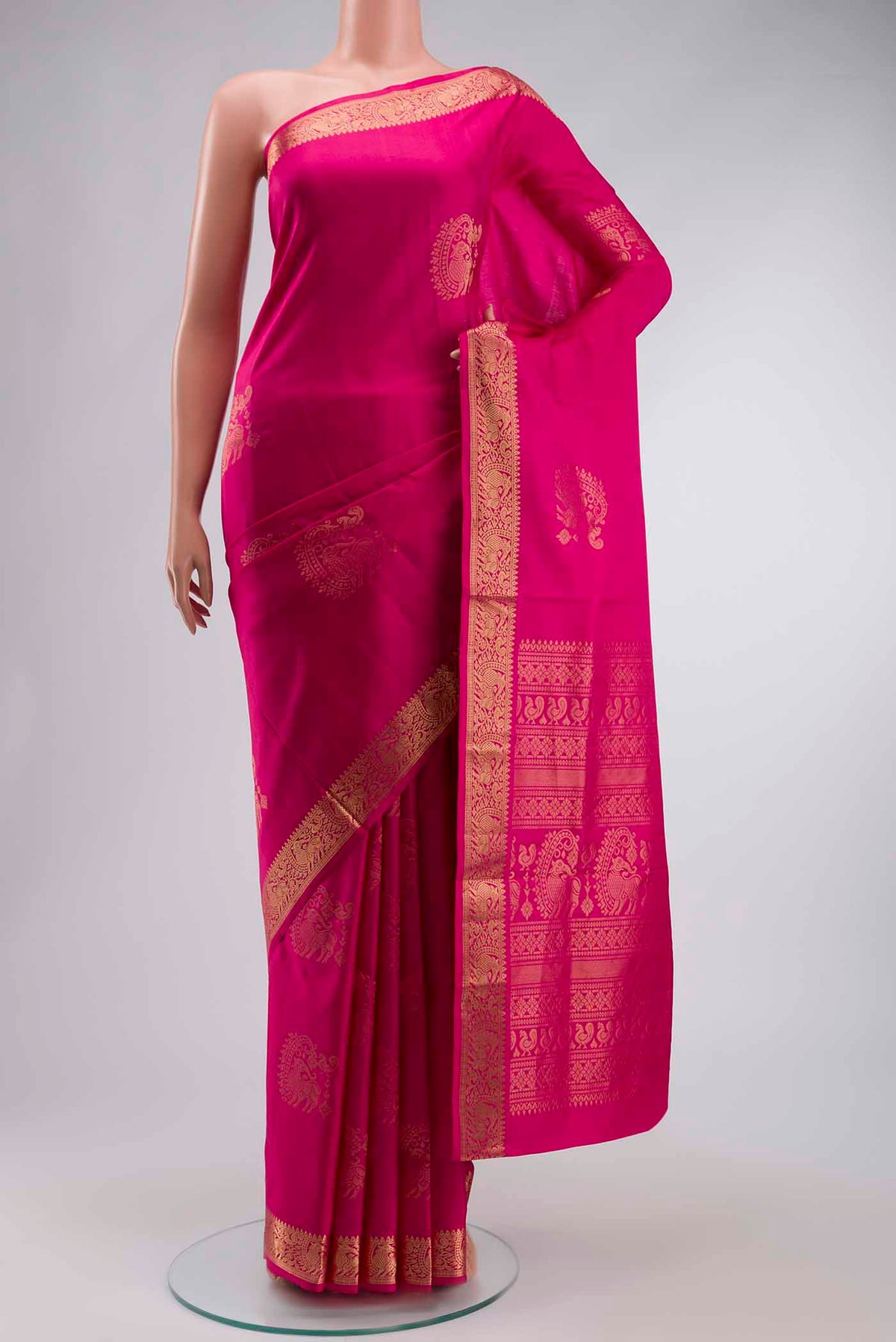 Pink Soft Silk Saree with Zari Butta on the body and Zari Border displayed on a mannequin