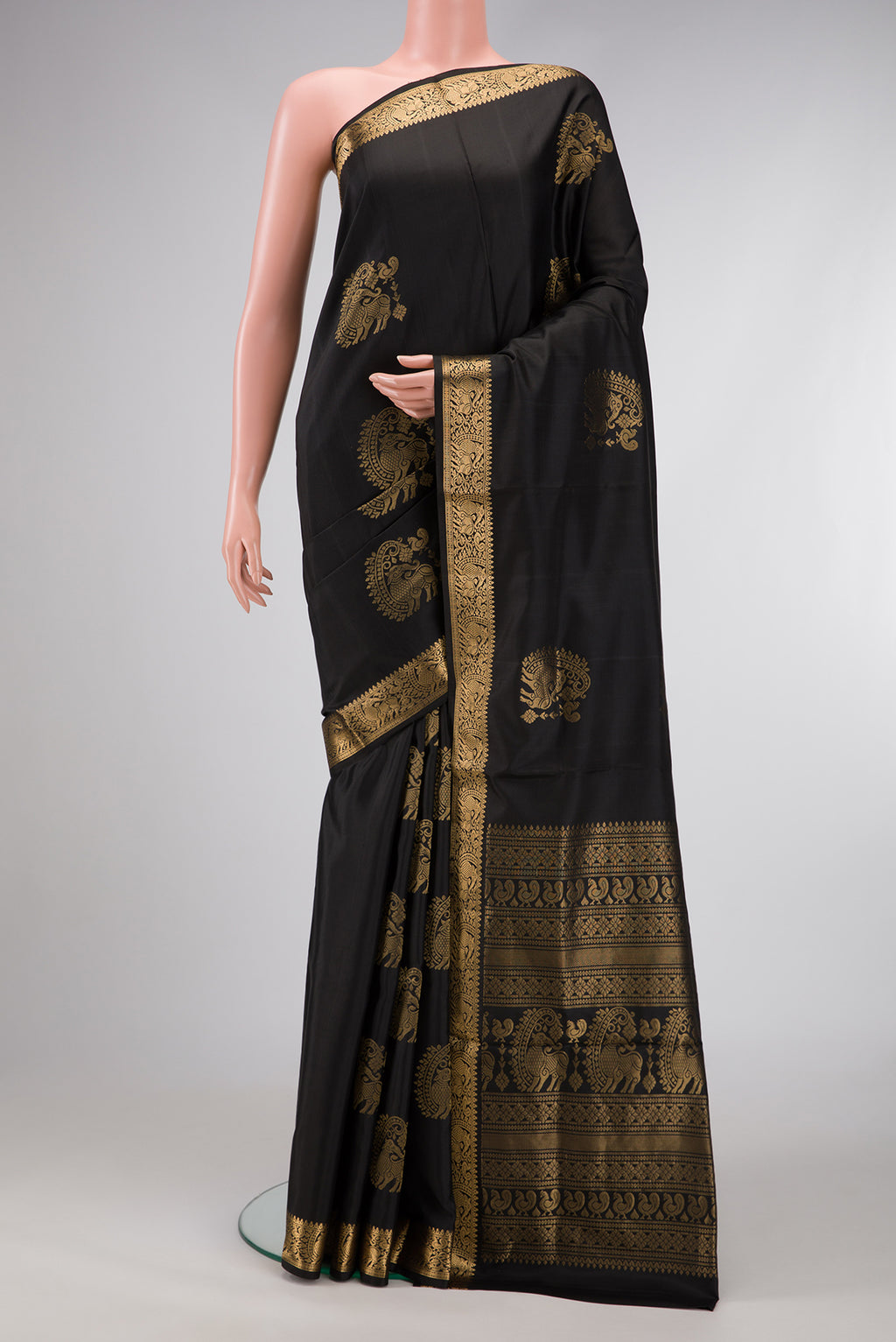 Black Dual Tone Soft Silk Saree with Zari Butta on the body and Zari Border.  displayed on a mannequin