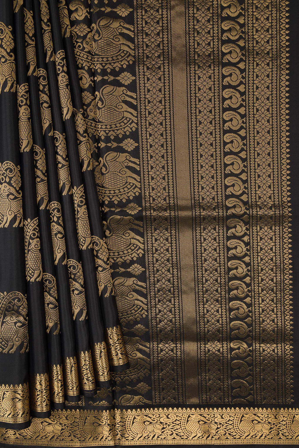 Pleats and pallu of Black Dual Tone Soft Silk Saree with Zari Butta on the body and Zari Border. 