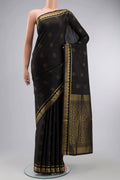 Black Soft Silk Saree with Zari Butta on the body and Zari Border displayed on a mannequin