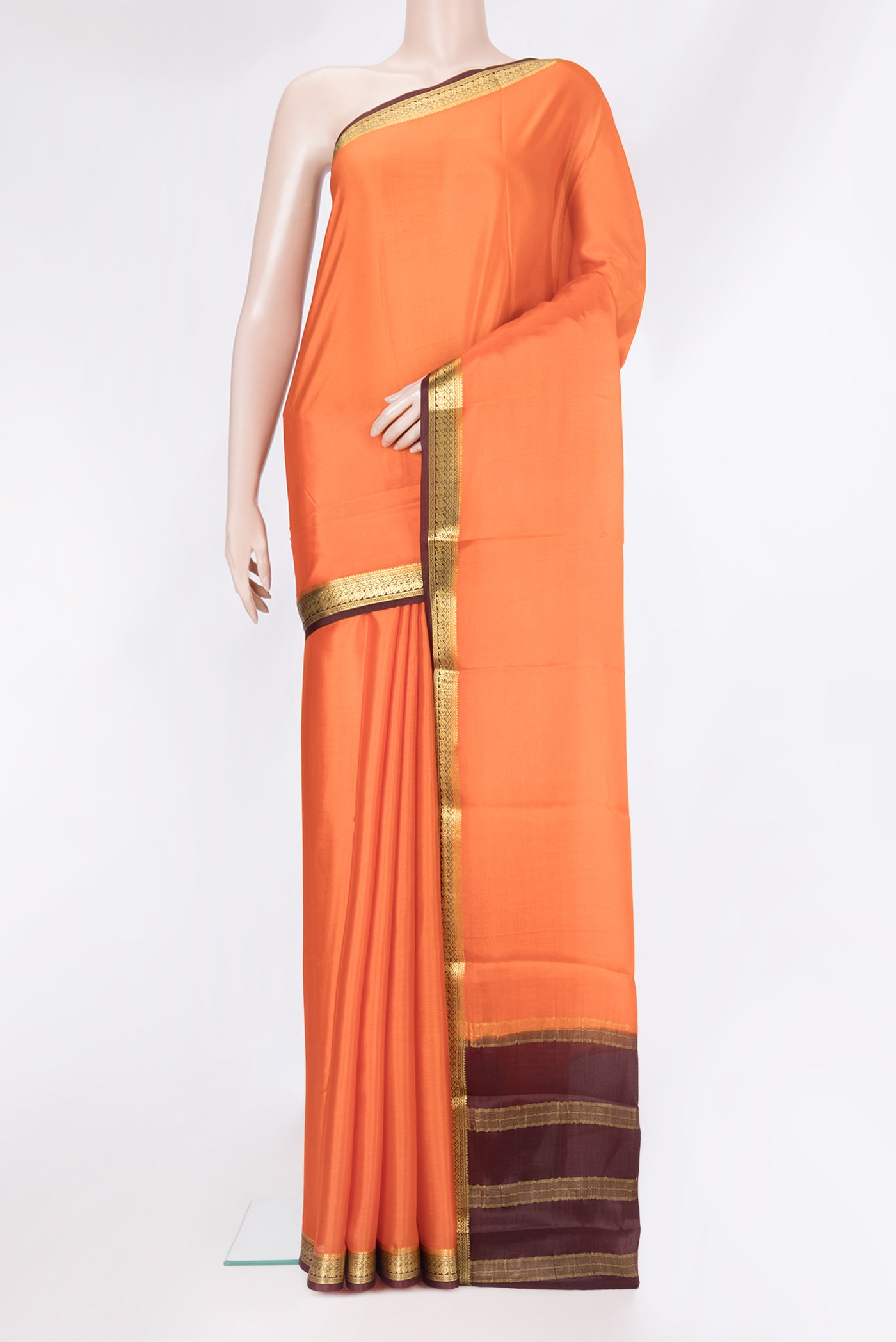 Orange Mysore Silk Saree with Plain Body and Zari Border.  displayed on a mannequin