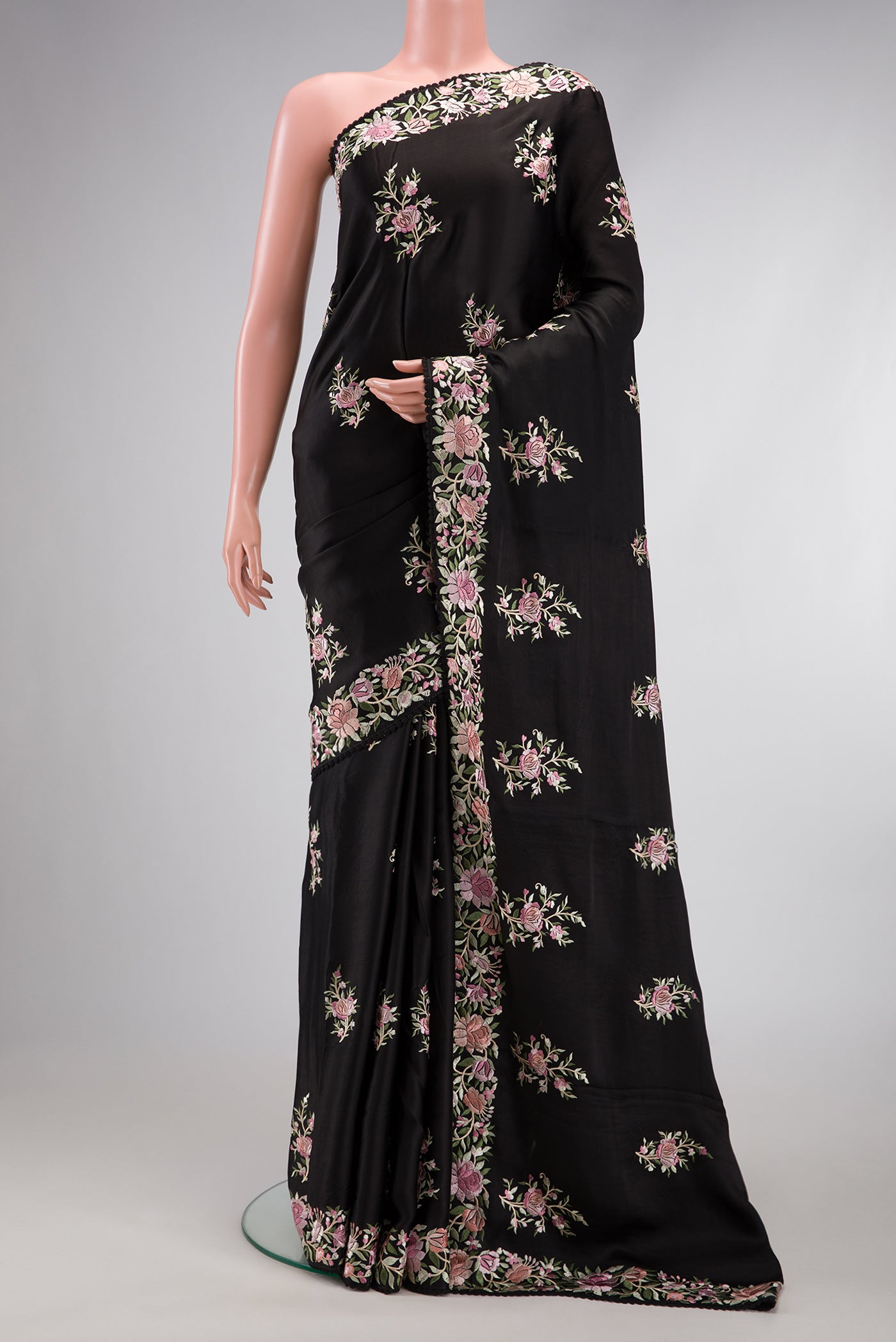Black Dual Tone Crepe Saree with Embroidery on the body and Embroidery Border.  displayed on a mannequin