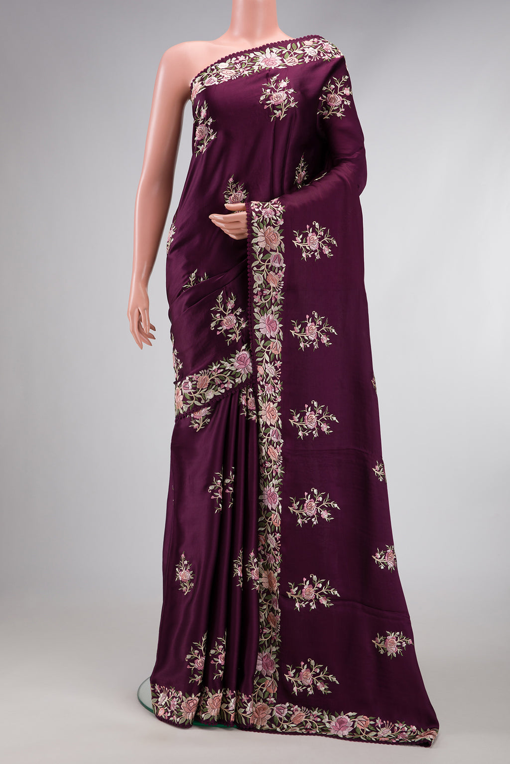 Burgundy Dual Tone Crepe Saree with Embroidery on the body and Embroidery Border.  displayed on a mannequin