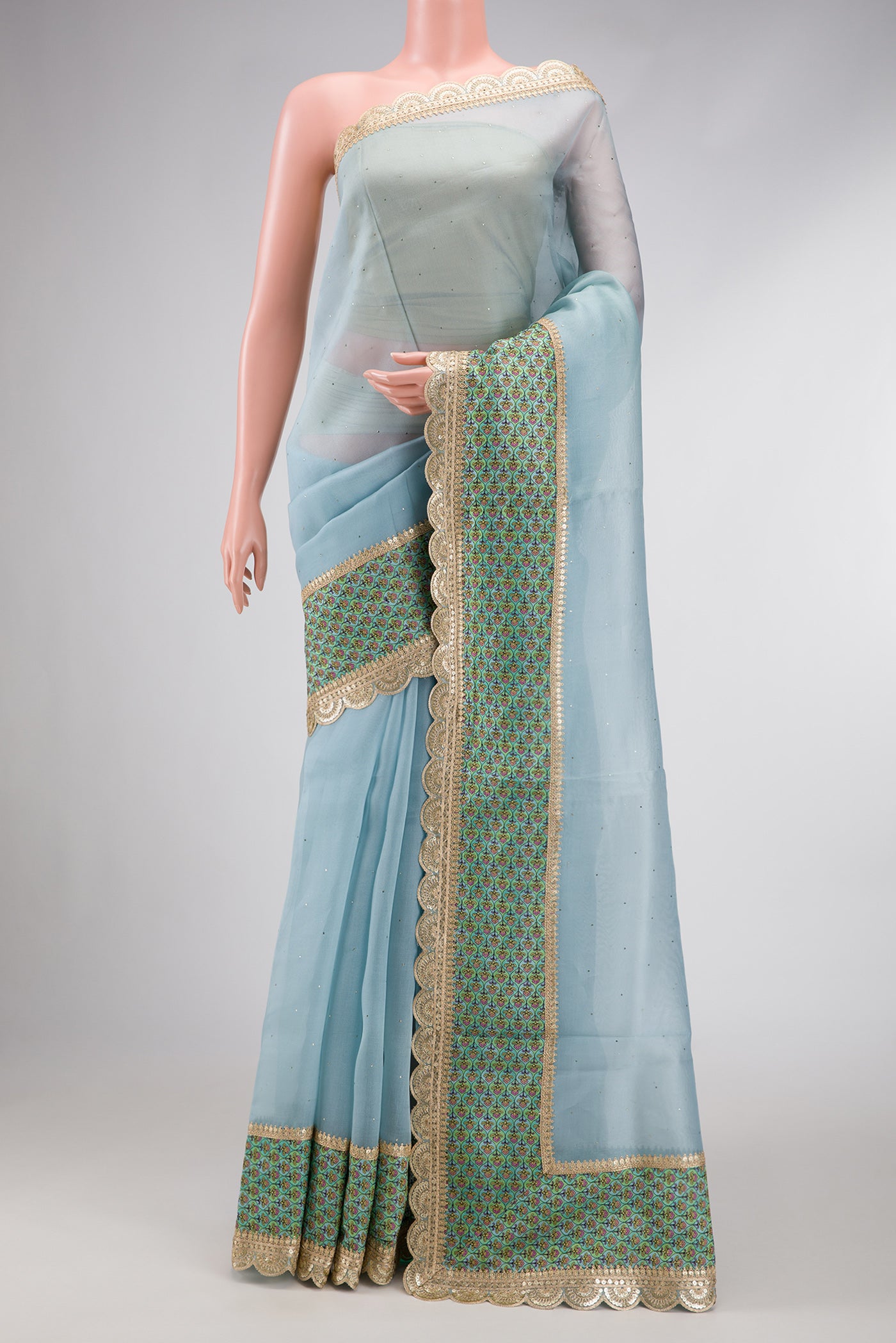 Sky Blue Dual Tone Organza Silk Saree with Embroidery on the body and Embroidery Border.  displayed on a mannequin