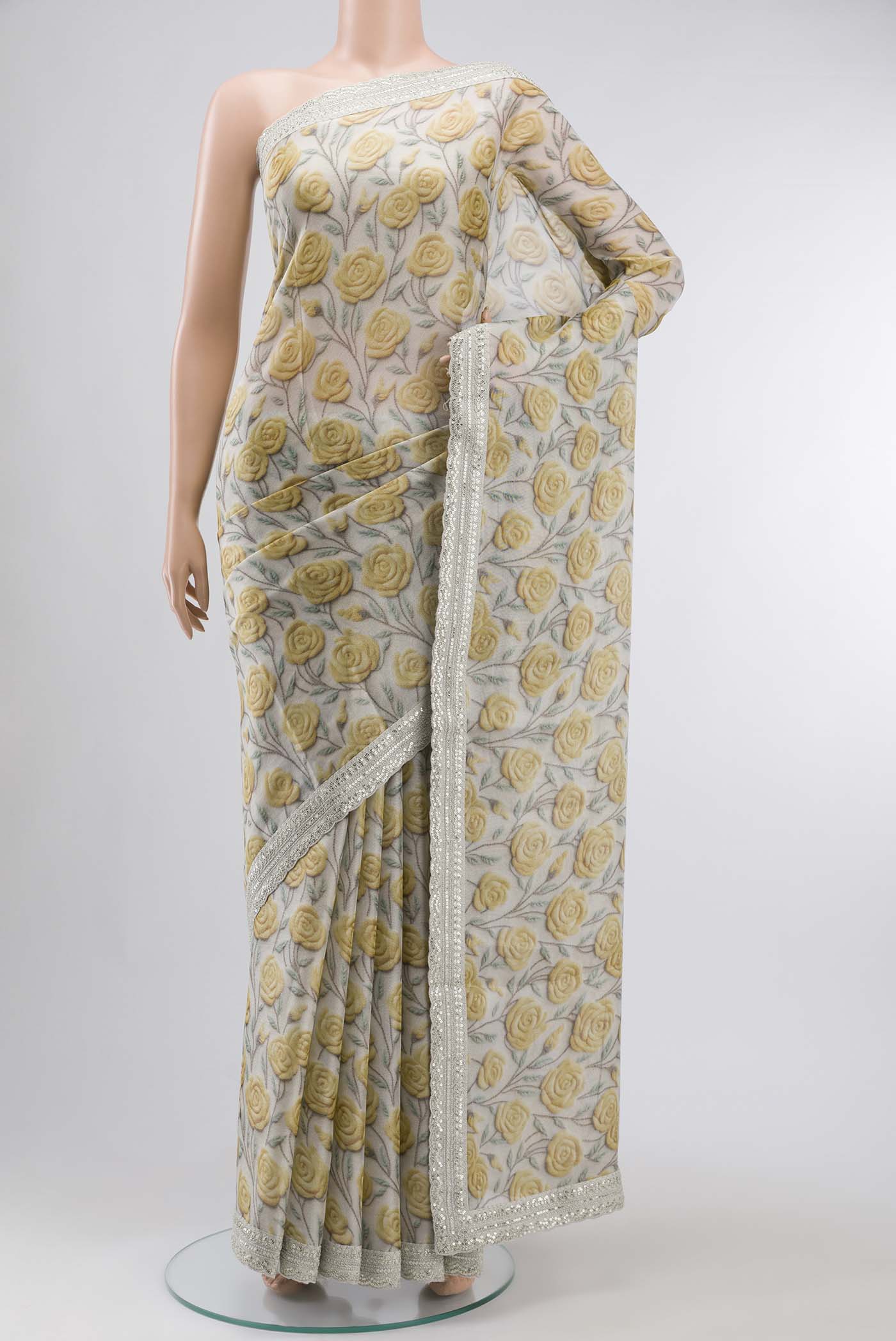 Grey Mysore Georgette Saree with Printed design on the body and Embroidery Border displayed on a mannequin