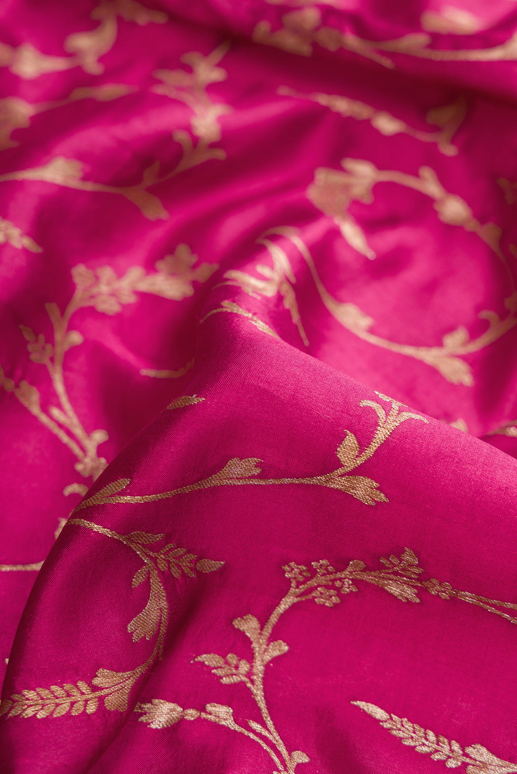 Close up of Magenta Dual Tone Tussar Silk Saree with Zari Brocade on the body and Fancy Border.  displaying folds