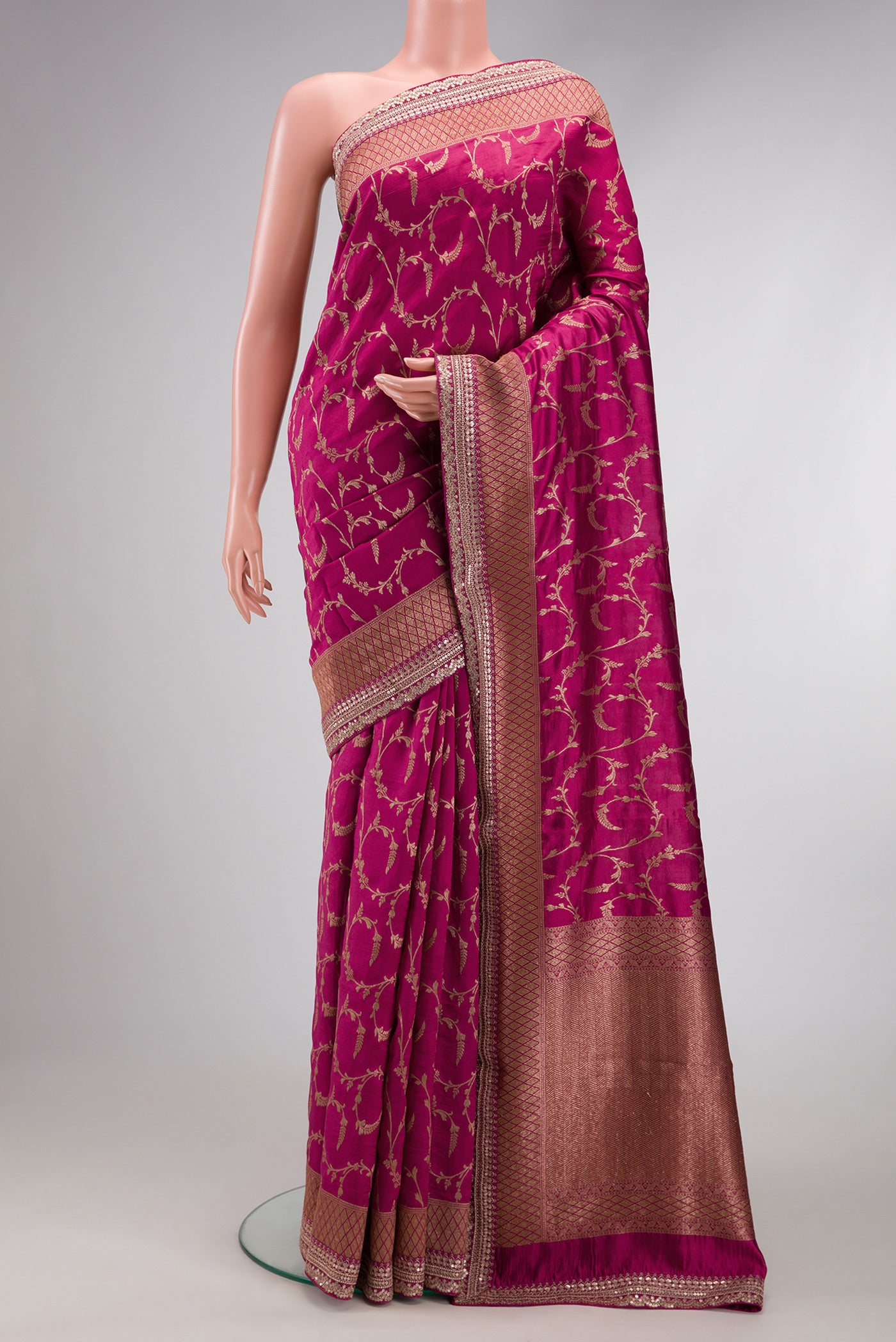 Magenta Dual Tone Tussar Silk Saree with Zari Brocade on the body and Fancy Border.  displayed on a mannequin