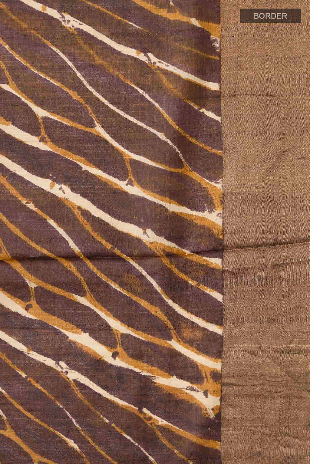 Border image of Brown Tussar Silk Saree with Printed design on the body and Zari Border