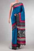 Sky Blue Dual Tone Tussar Silk Saree with Plain Body and Printed Border.  displayed on a mannequin