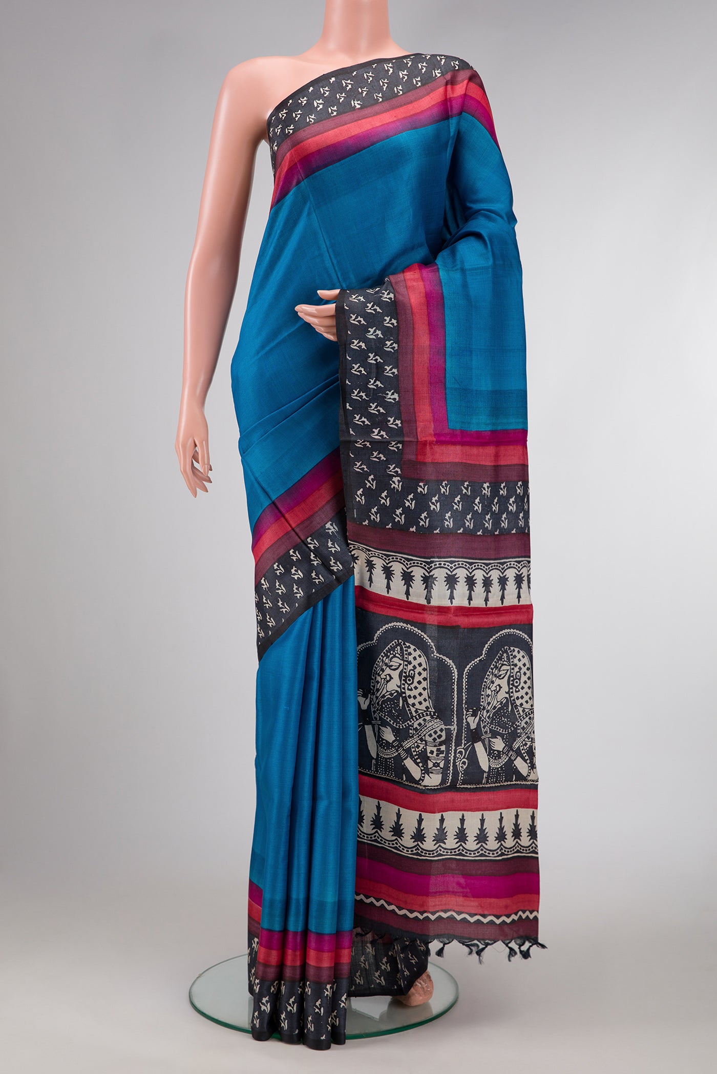 Sky Blue Dual Tone Tussar Silk Saree with Plain Body and Printed Border.  displayed on a mannequin