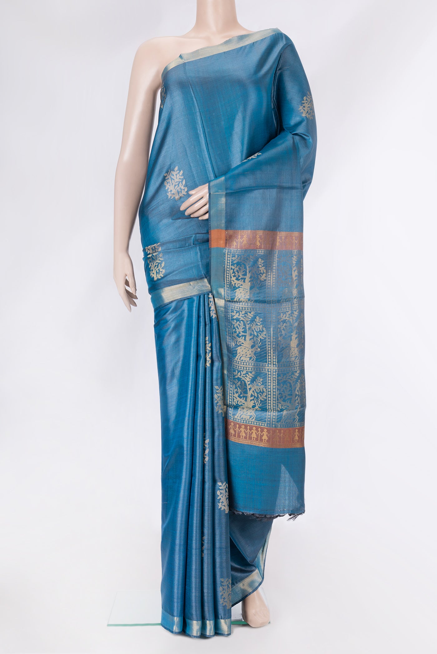 Peacock Blue Dual Tone Tussar Silk Saree with Zari And Thread Butta on the body and Zari Border.  displayed on a mannequin