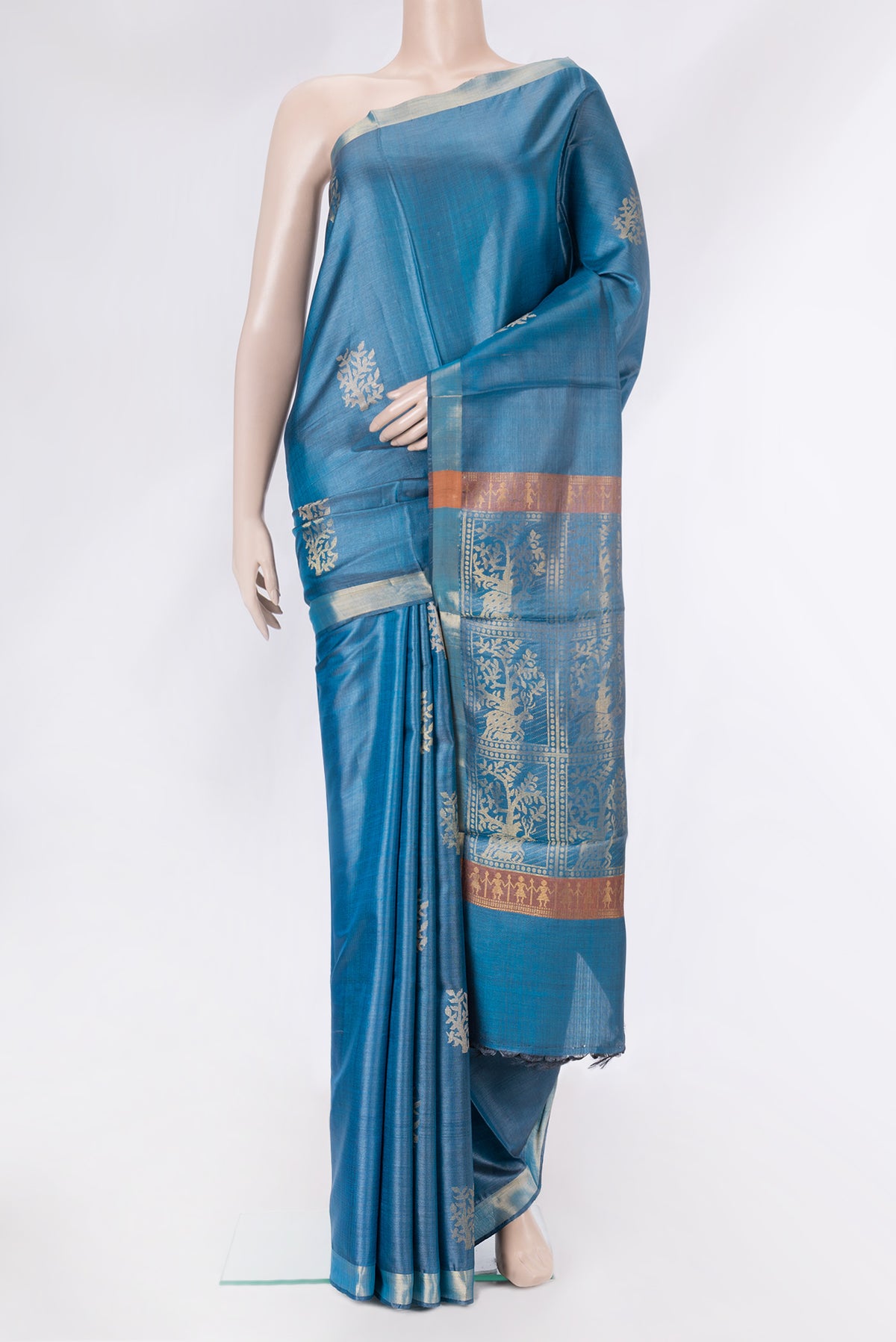 Peacock Blue Dual Tone Tussar Silk Saree with Zari And Thread Butta on the body and Zari Border.  displayed on a mannequin