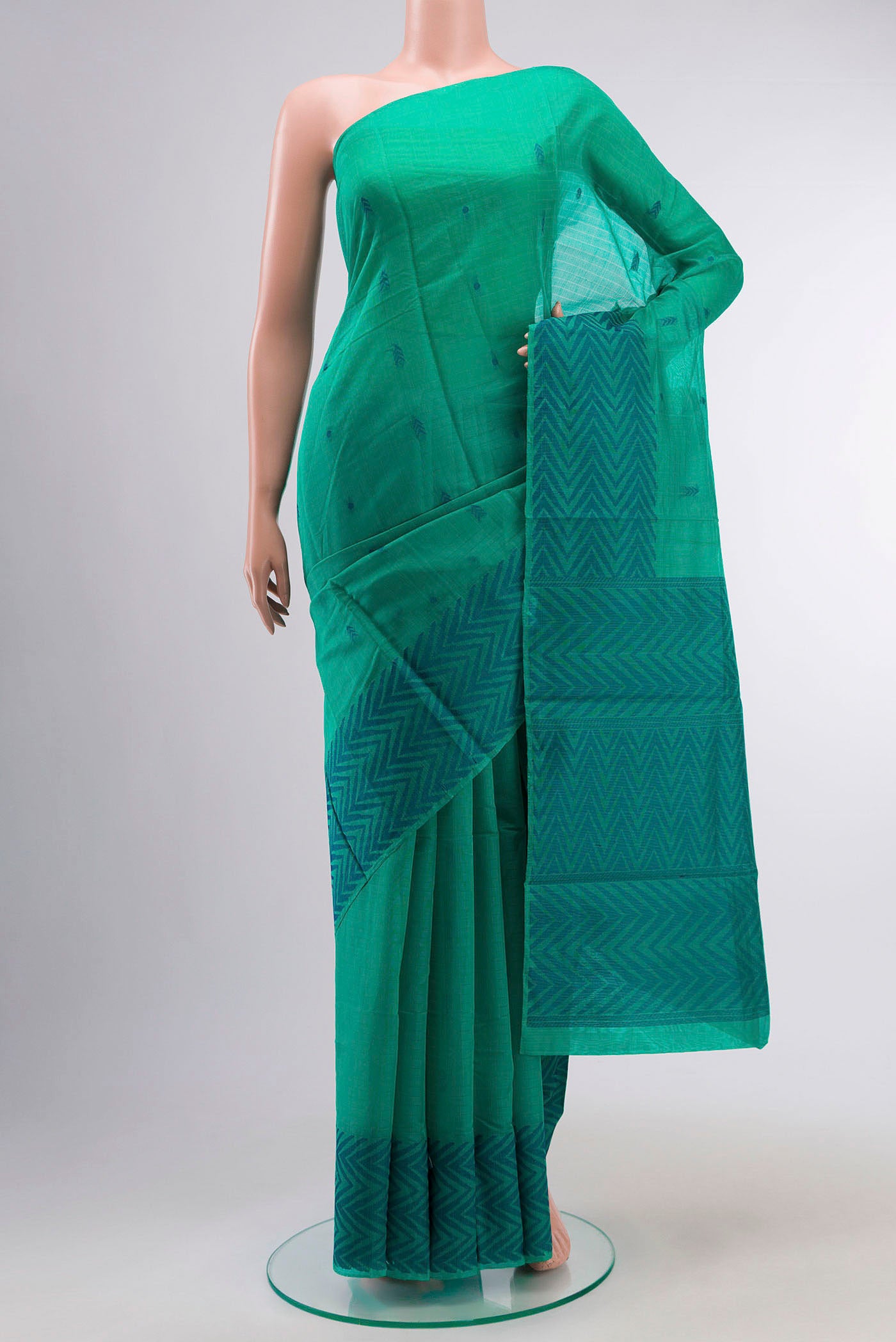 Green Silk Cotton Saree with Thread Butta on the body and Thread Border displayed on a mannequin