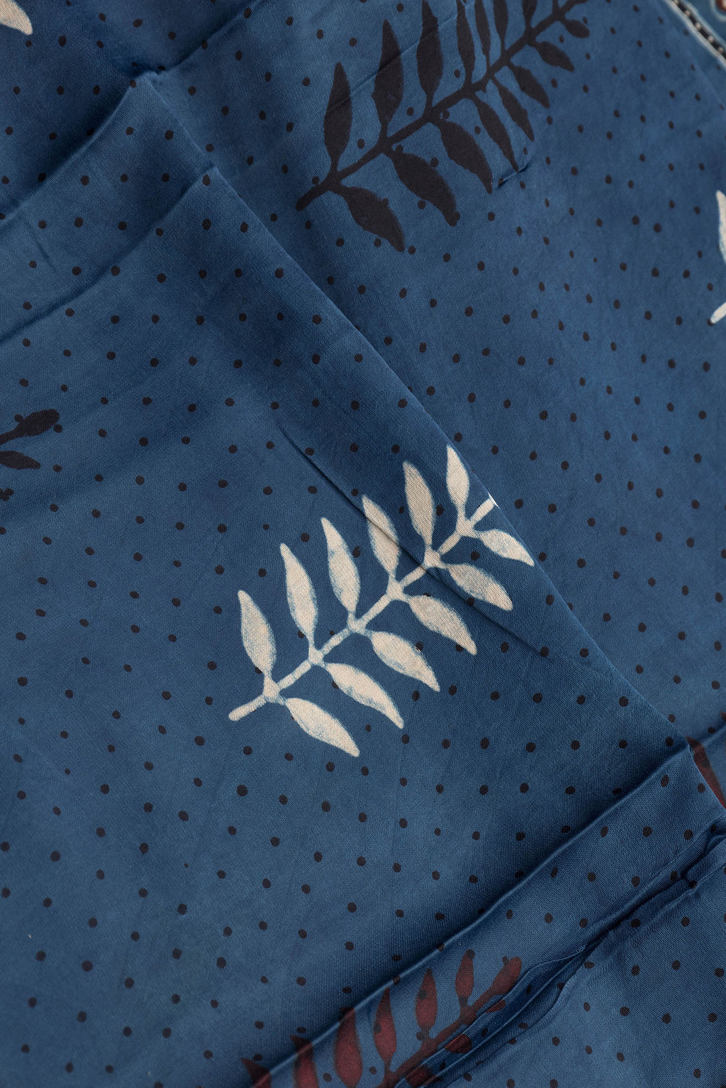 Close up of Indigo Dual Tone Blended Crepe Saree with Ajrakh Print on the body and Fancy Border.  displaying folds