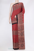 Maroon Dual Tone Crepe Saree with Ajrakh Print on the body and Fancy Border.  displayed on a mannequin