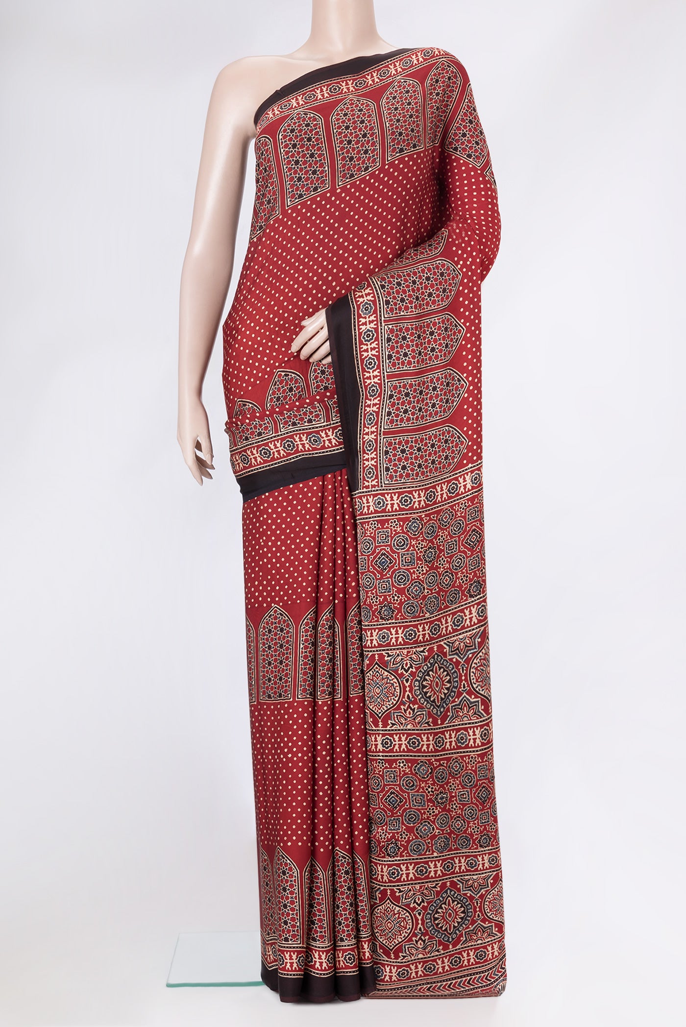 Maroon Dual Tone Crepe Saree with Ajrakh Print on the body and Fancy Border.  displayed on a mannequin