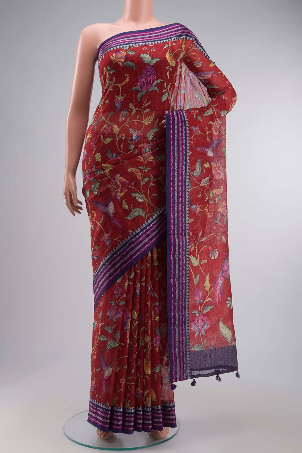 Red Kota Silk Saree with Printed design on the body and Thread Border displayed on a mannequin