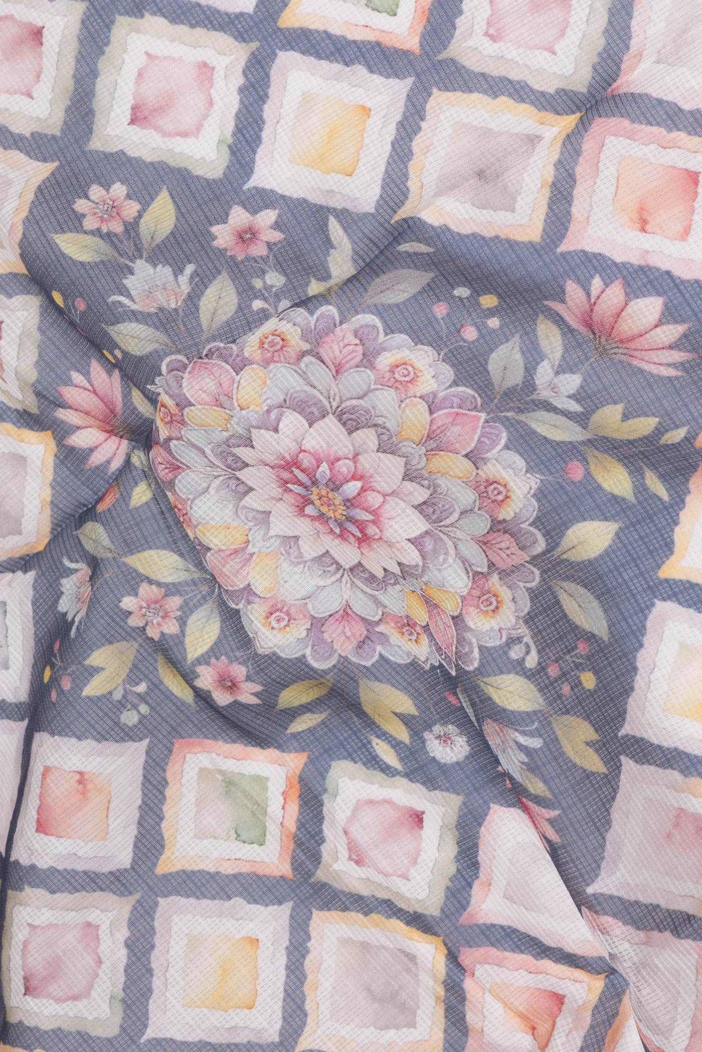Close up of Beige Kota Silk Saree with Printed design on the body and Thread Border.  displaying folds