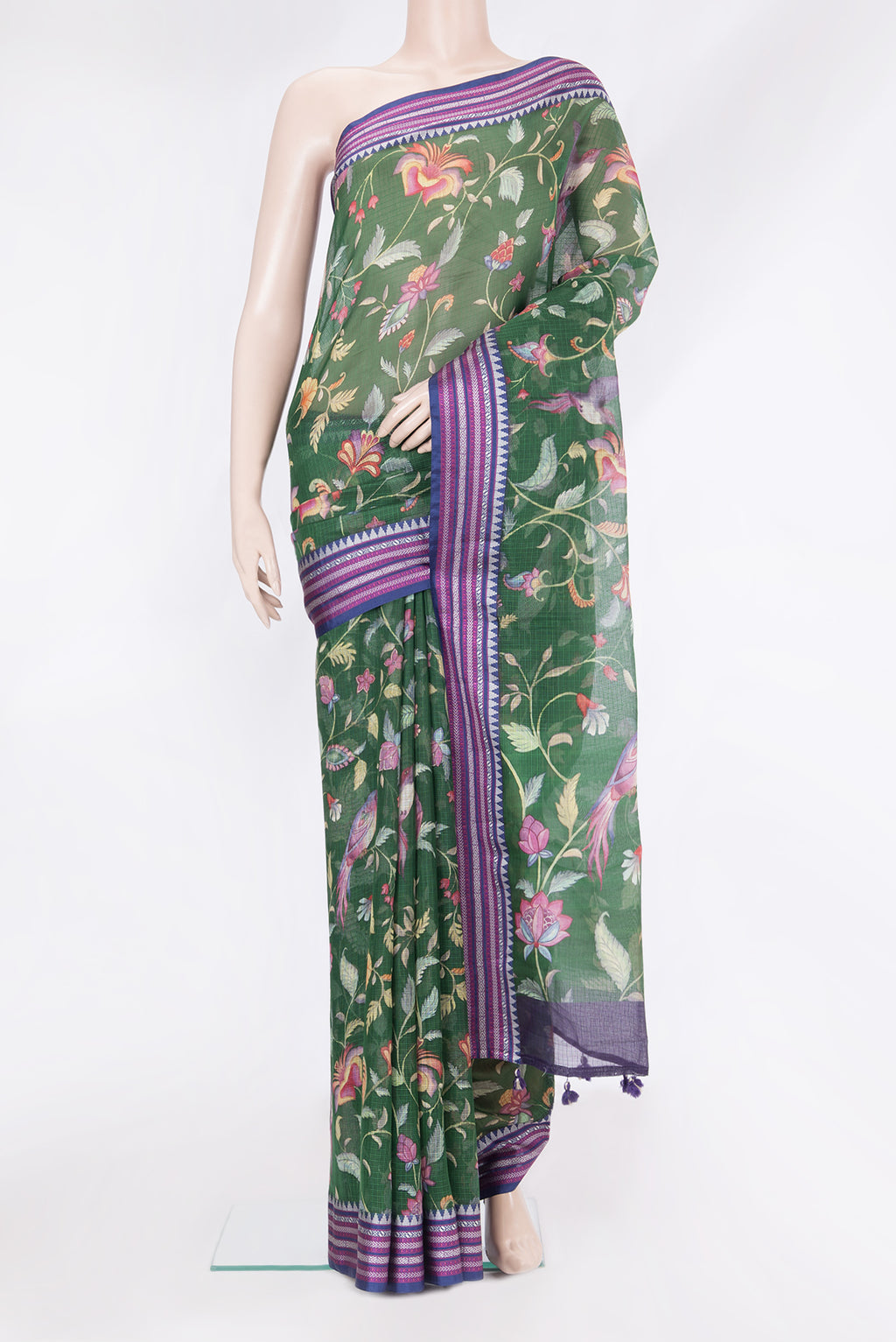 Green Kota Silk Saree with Floral Print on the body and Thread Border.  displayed on a mannequin