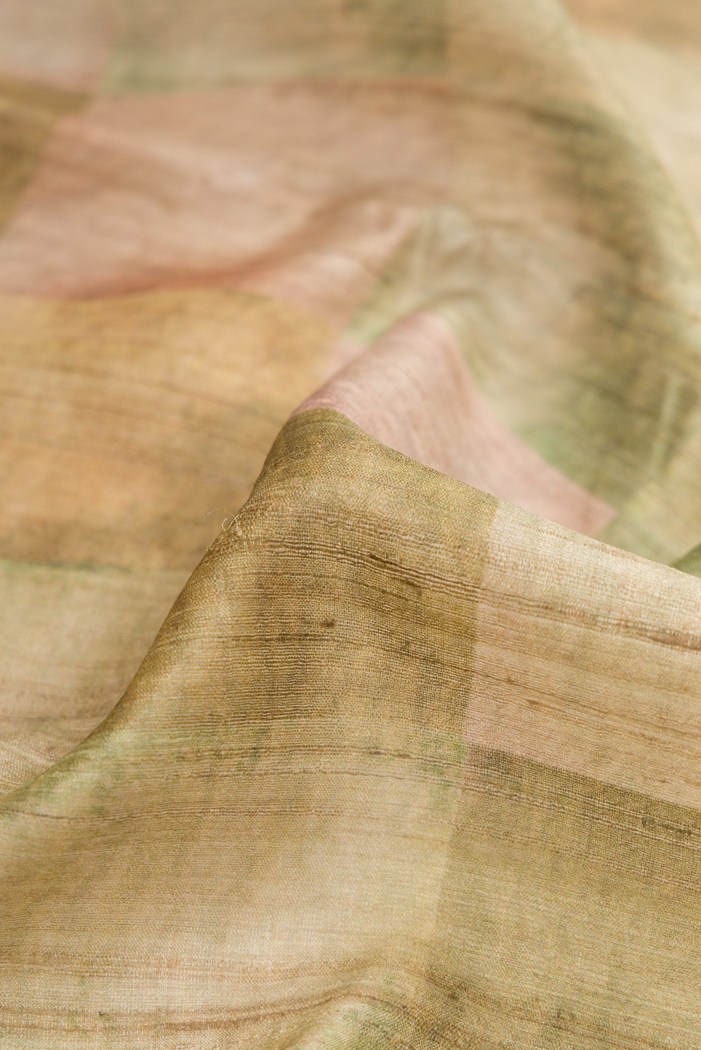 Close up of Pista Green Dual Tone Tussar Silk Saree with Checked design on the body and Zari Border.  displaying folds
