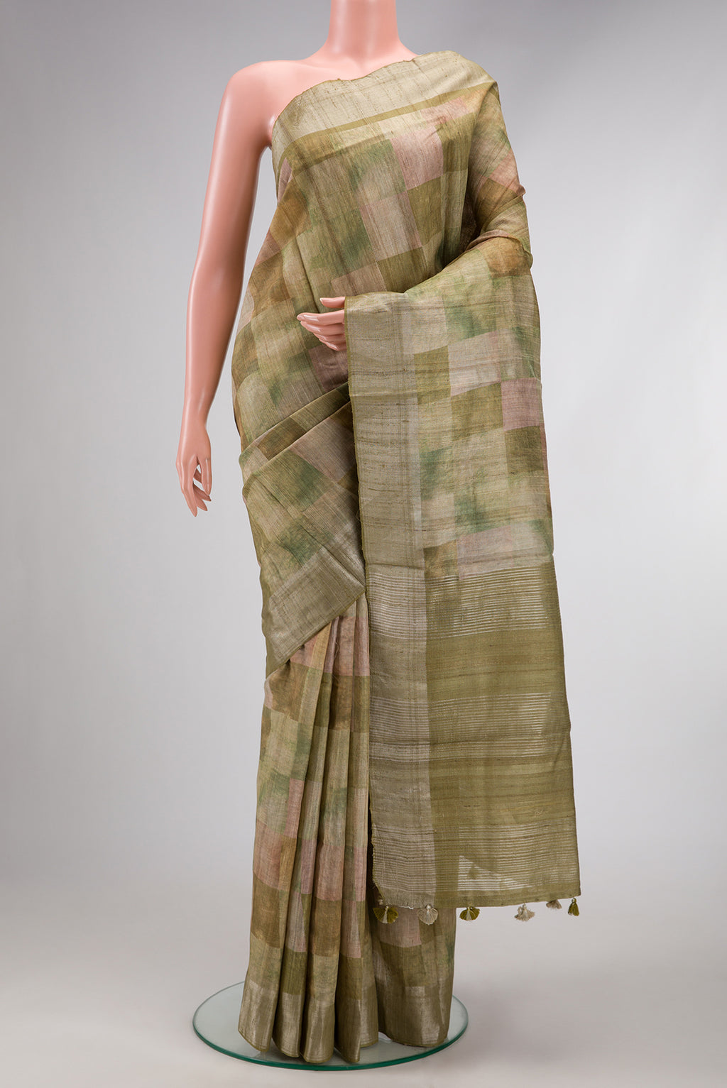 Pista Green Dual Tone Tussar Silk Saree with Checked design on the body and Zari Border.  displayed on a mannequin
