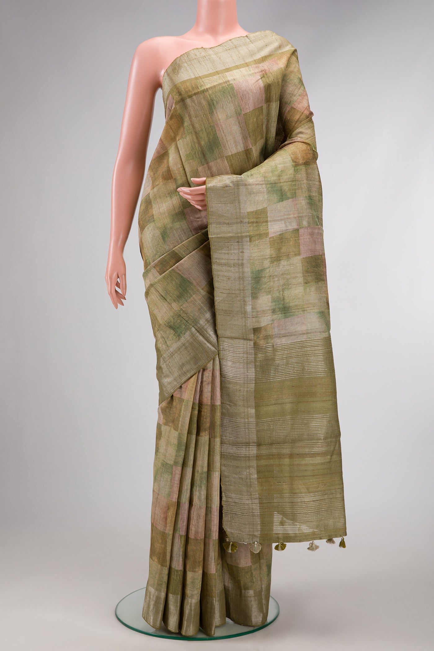 Pista Green Dual Tone Tussar Silk Saree with Checked design on the body and Zari Border.  displayed on a mannequin