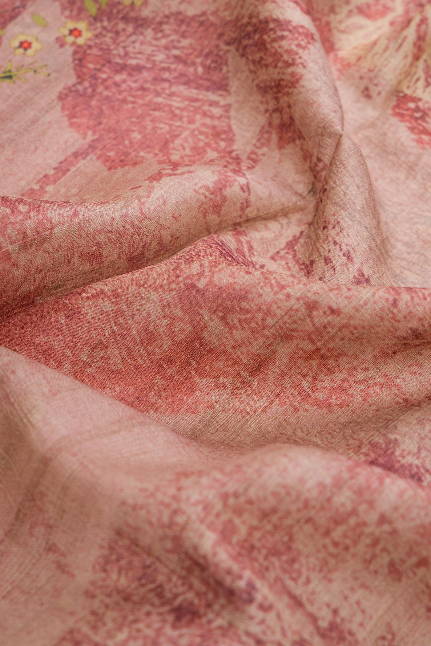 Close up of Pink Dual Tone Tussar Silk Saree with Printed design on the body and Zari Border.  displaying folds