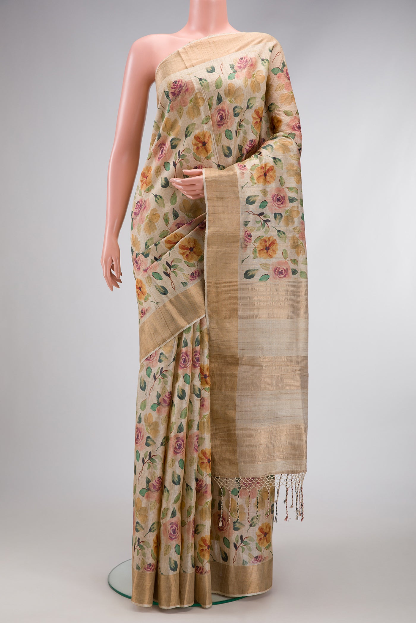 Beige Dual Tone Tussar Silk Saree with Printed design on the body and Zari Border.  displayed on a mannequin
