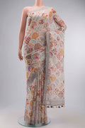 Grey Linen Cotton Saree with Printed design on the body and Zari Border displayed on a mannequin