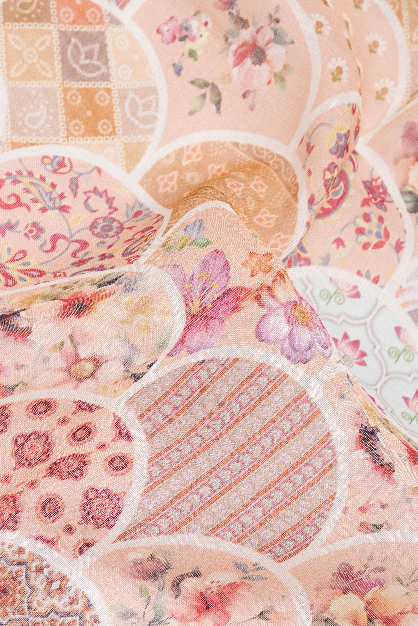 Close up of Peach Linen Saree with Printed design on the body and Zari Border.  displaying folds