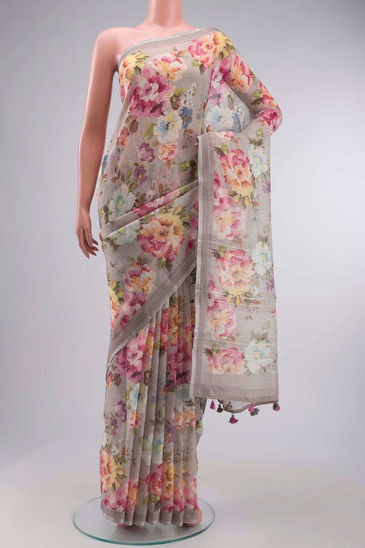 Grey Linen Cotton Saree with Printed design on the body and Zari Border displayed on a mannequin