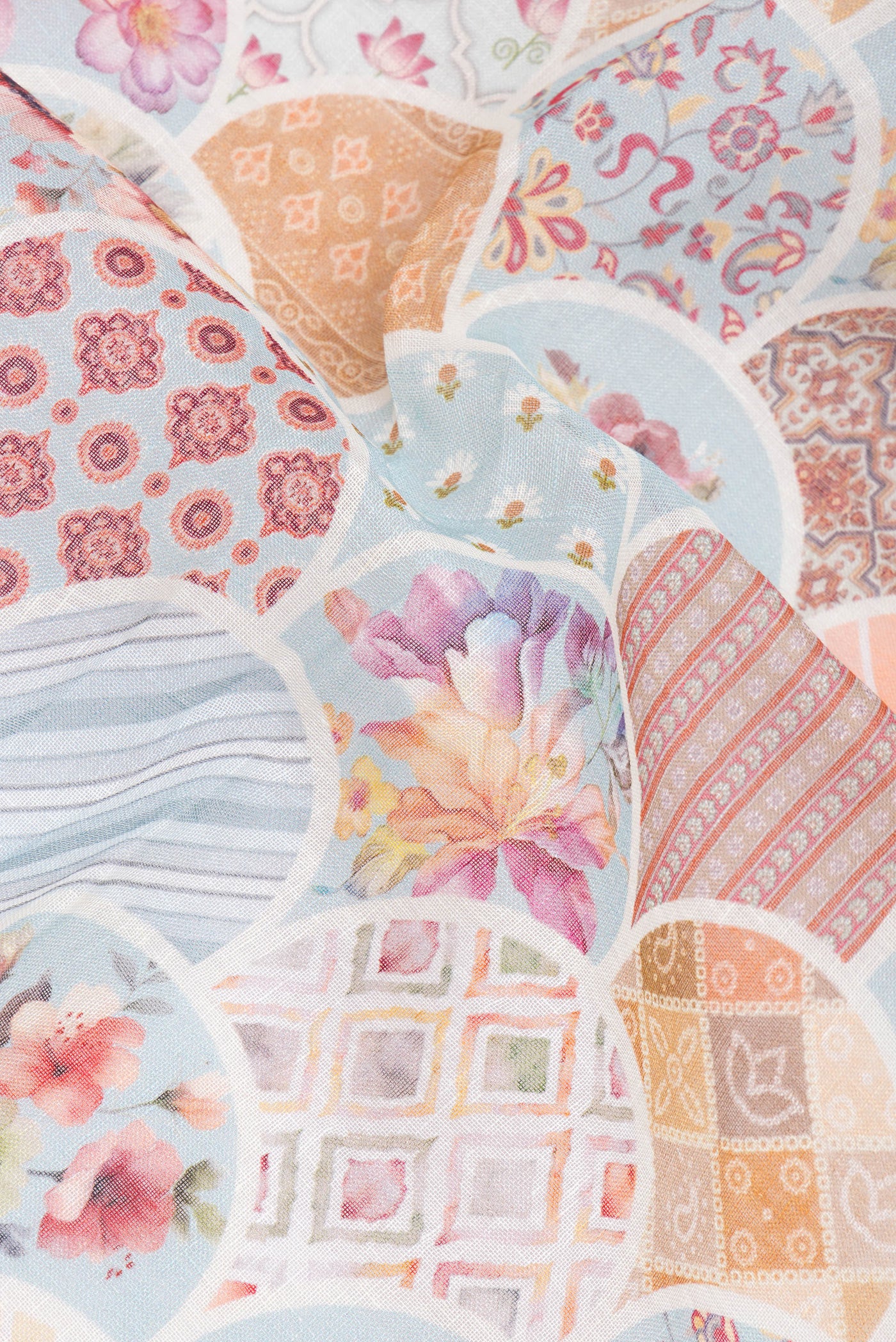 Close up of Sky Blue Linen Saree with Printed design on the body and Zari Border.  displaying folds