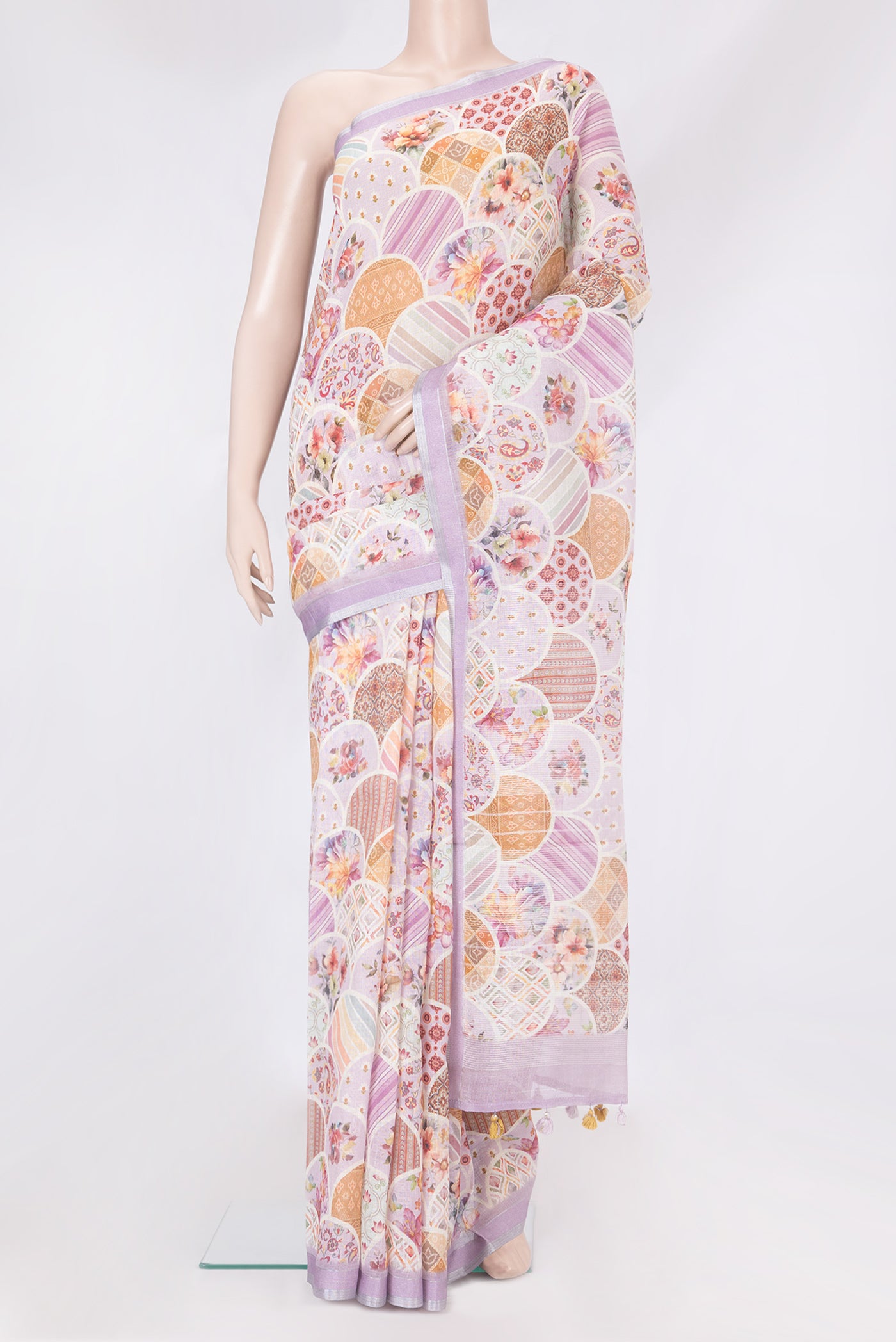 Lavender Linen Saree with Printed design on the body and Zari Border.  displayed on a mannequin