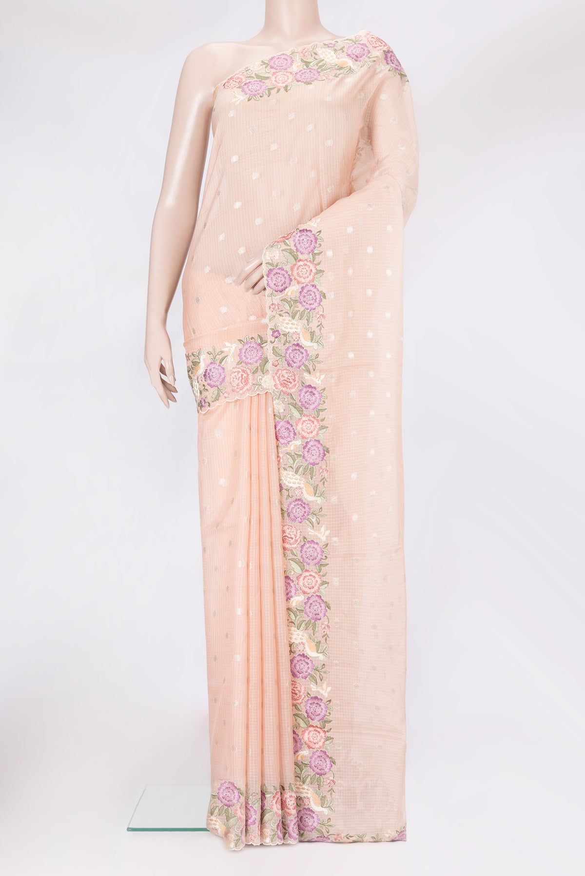 Peach Kota Silk Saree with Zari Butta on the body and Embroidery Border.  displayed on a mannequin