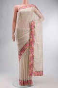 Beige Kota Cotton Saree with Checked design on the body and Embroidery Border displayed on a mannequin