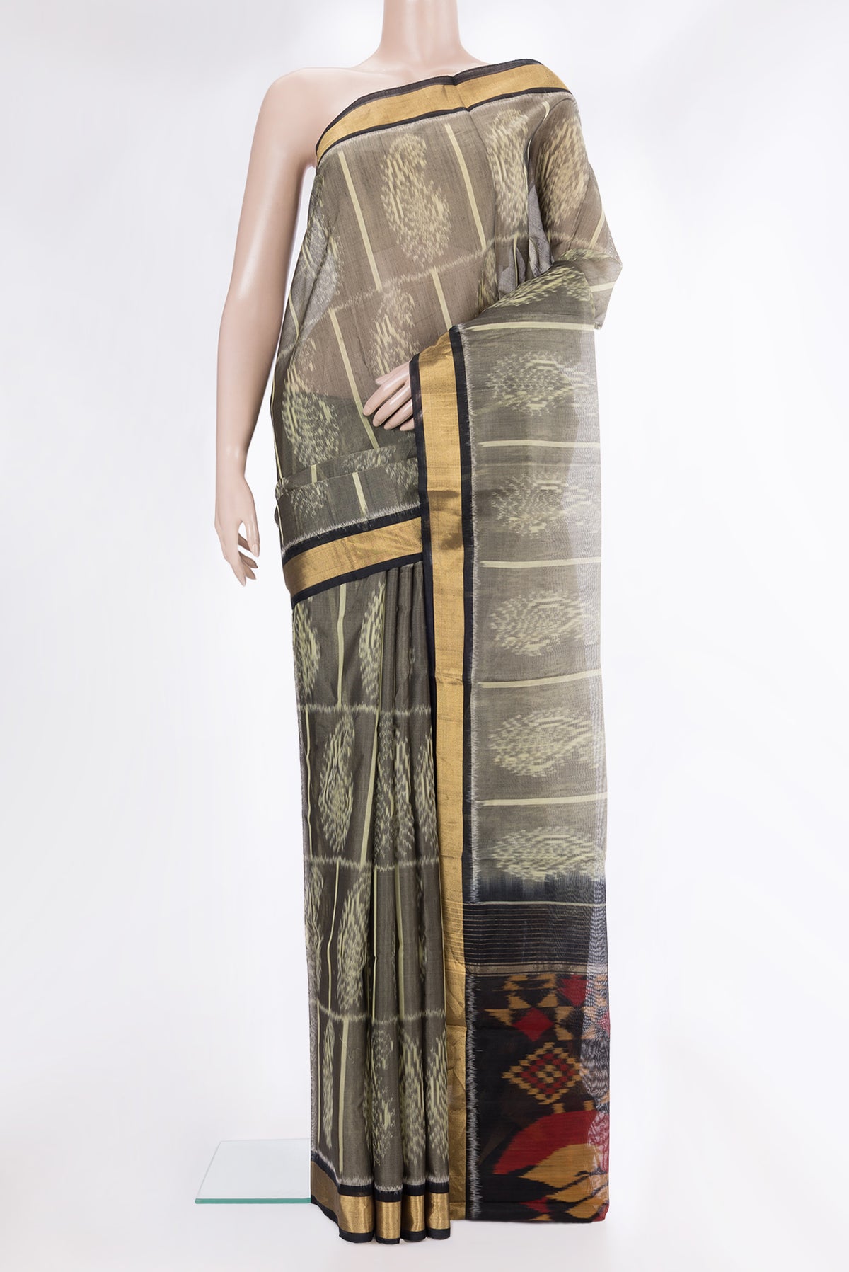 Grey Silk Cotton Saree with Ikat Print on the body and Zari Border.  displayed on a mannequin