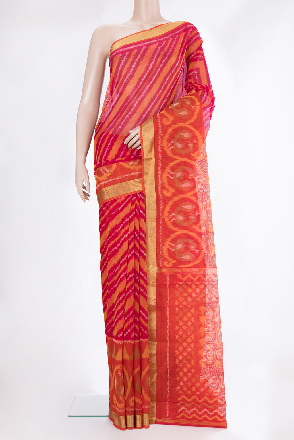 Multi Color Silk Cotton Saree with Ikat Print on the body and Ikat Border.  displayed on a mannequin