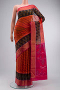Orange Silk Cotton Saree with Ikat Print on the body and Zari Border displayed on a mannequin