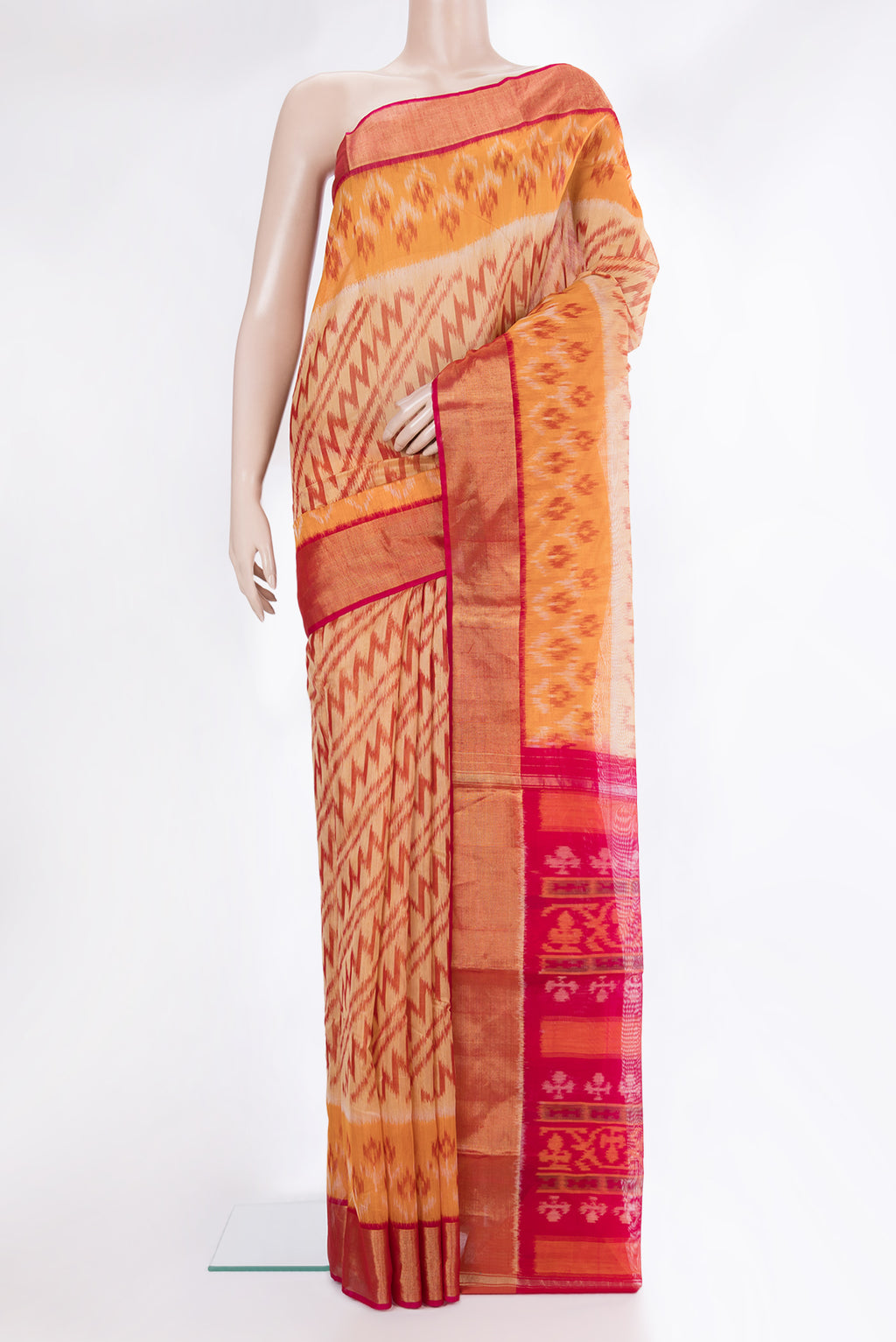 Sandal Silk Cotton Saree with Ikat Print on the body and Ikat Border.  displayed on a mannequin