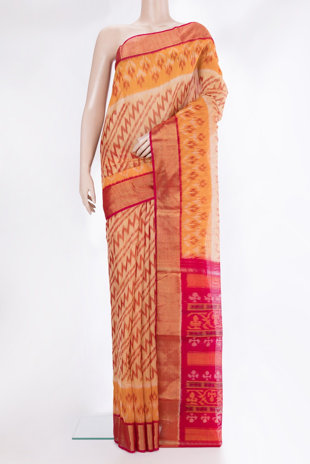 Sandal Silk Cotton Saree with Ikat Print on the body and Ikat Border.  displayed on a mannequin