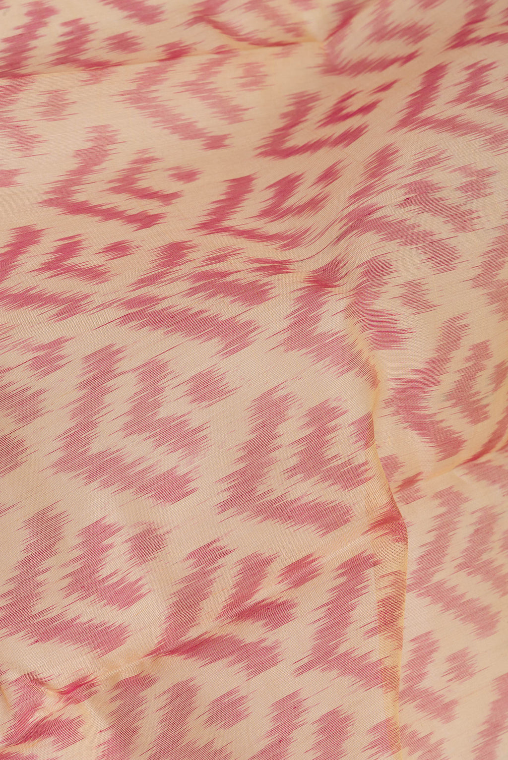 Close up of Sandal Silk Cotton Saree with Ikat Print on the body and Zari Border.  displaying folds