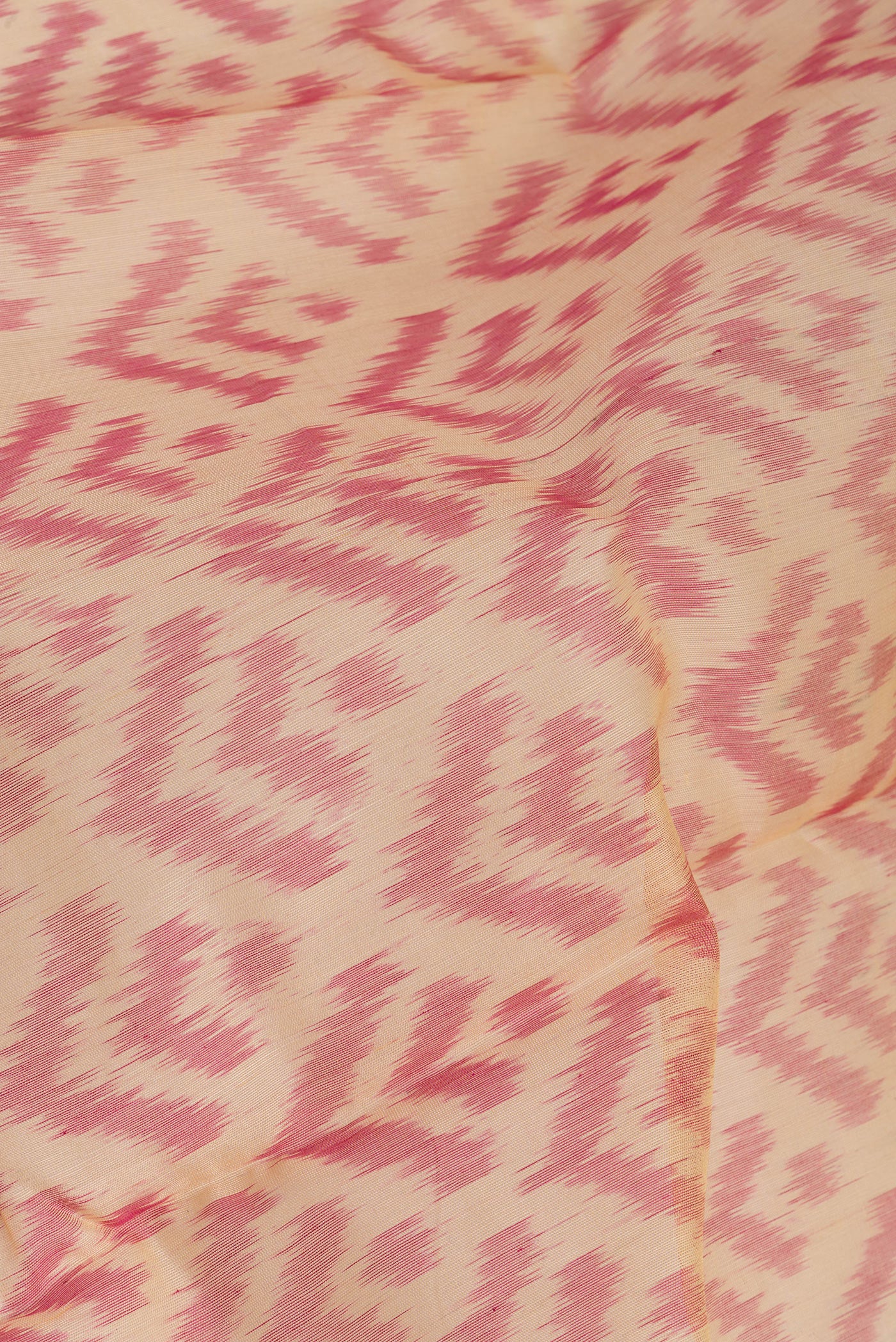 Close up of Sandal Silk Cotton Saree with Ikat Print on the body and Zari Border.  displaying folds