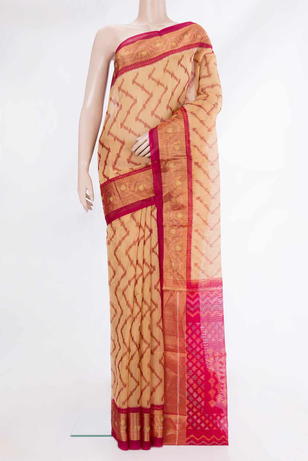Sandal Silk Cotton Saree with Ikat Print on the body and Zari Border.  displayed on a mannequin