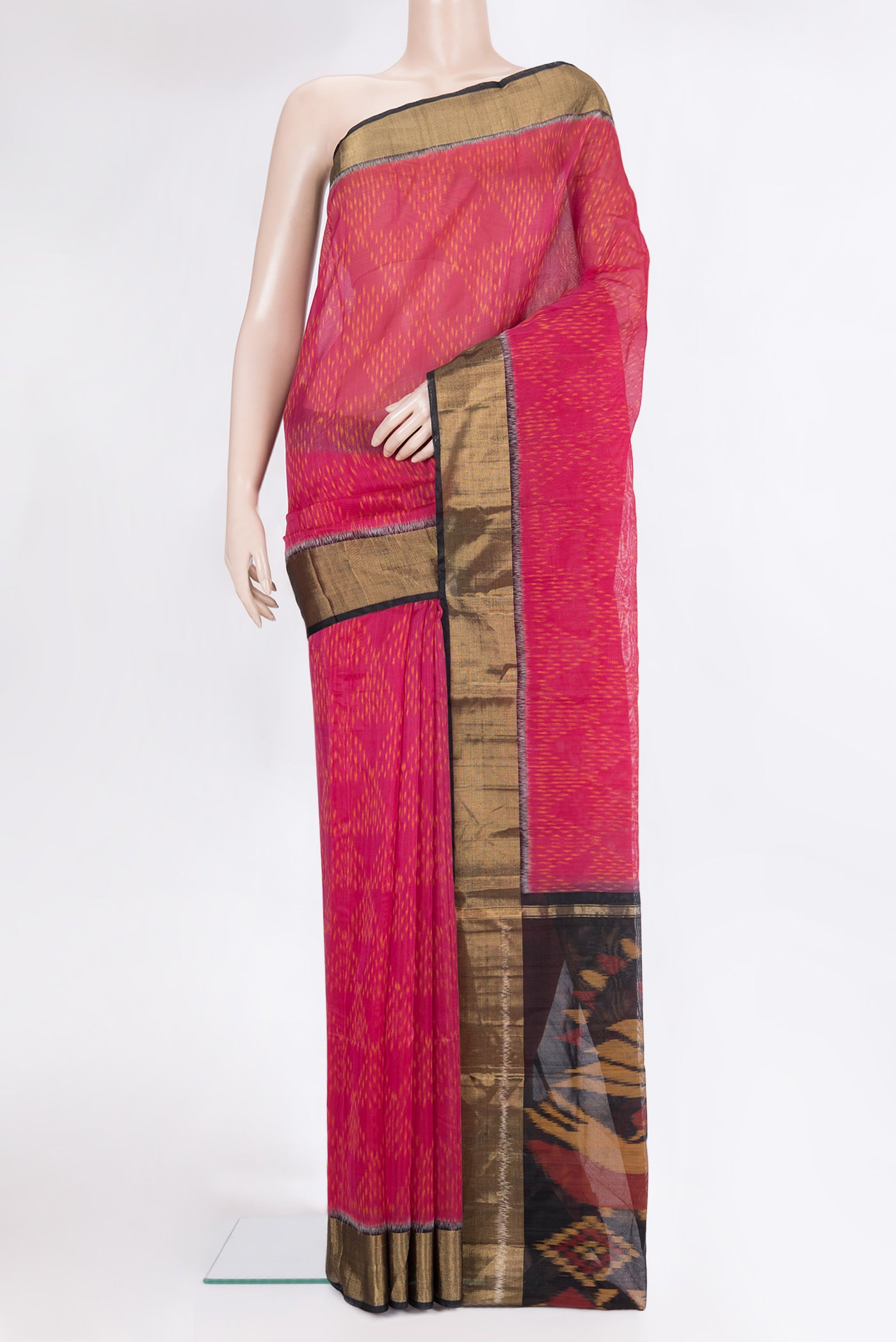 Dark Pink Silk Cotton Saree with Ikat Print on the body and Zari Border.  displayed on a mannequin