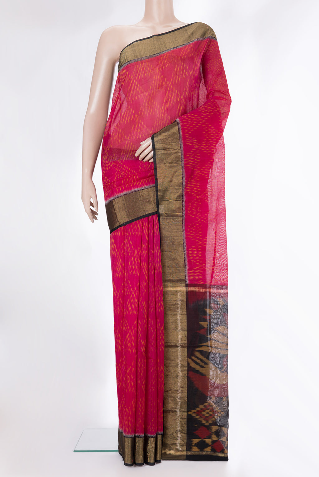 Dark Pink Silk Cotton Saree with Ikat Print on the body and Zari Border.  displayed on a mannequin