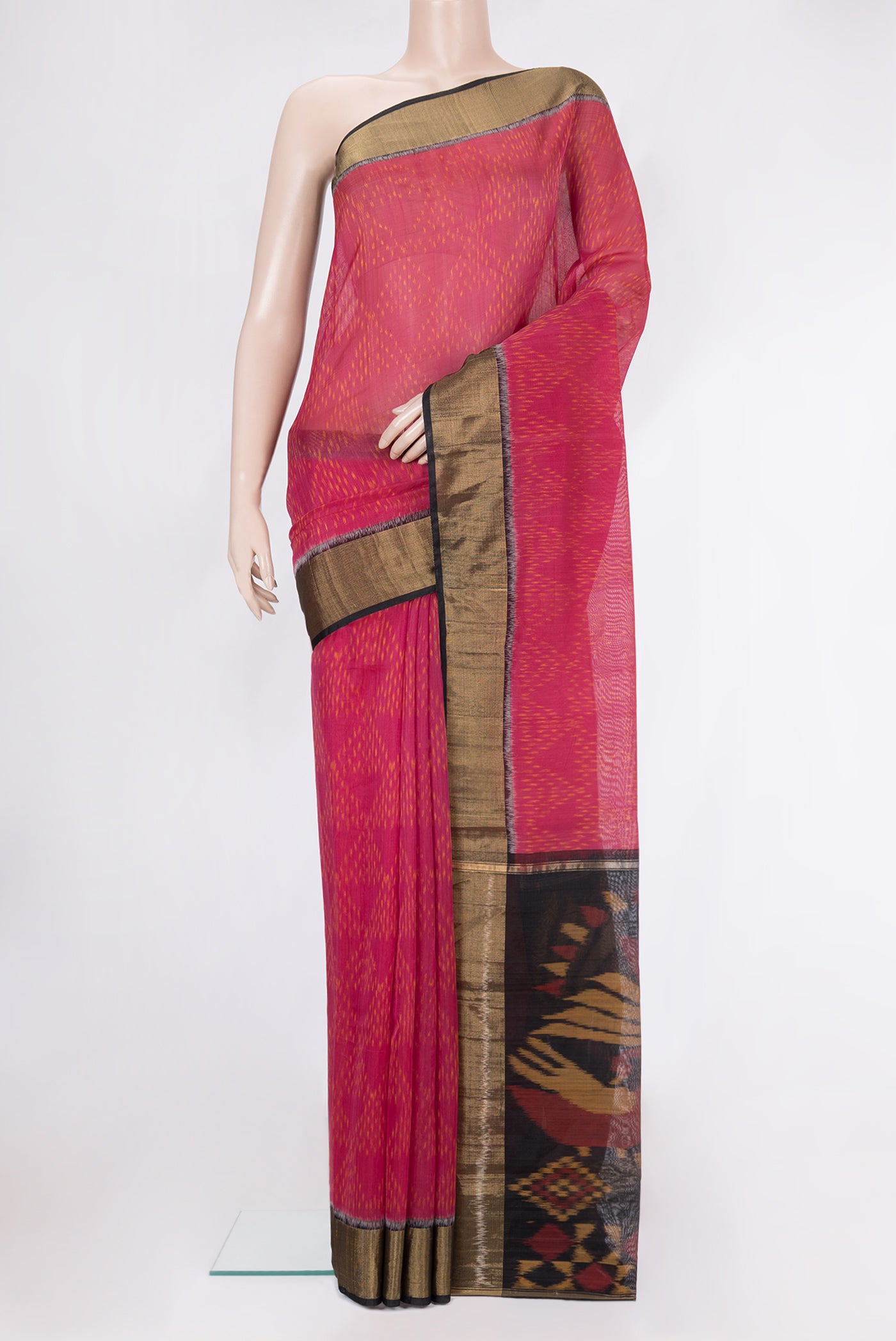 Dark Pink Silk Cotton Saree with Ikat Print on the body and Zari Border.  displayed on a mannequin