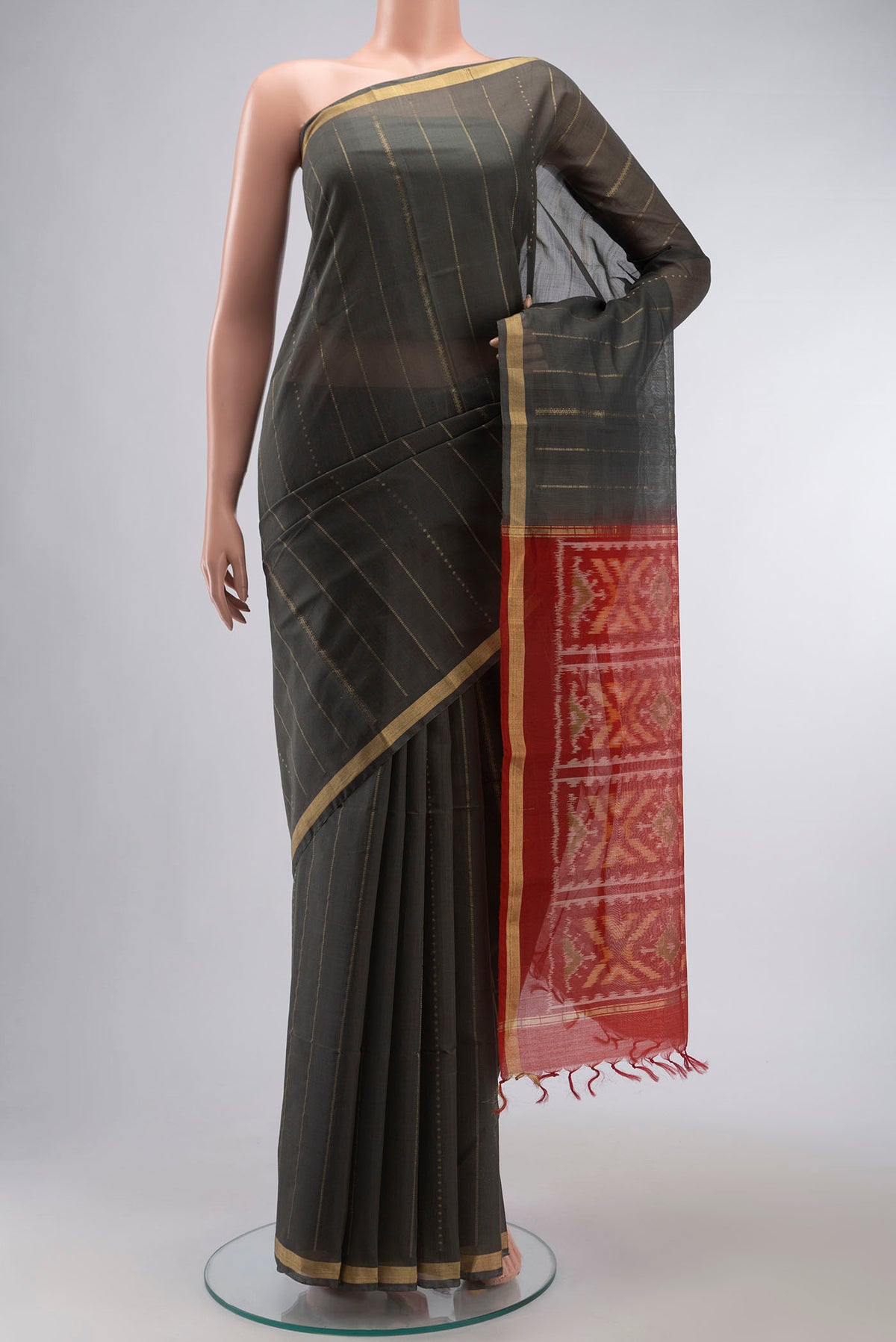 Grey Silk Cotton Saree with Stripes on the body and Zari Border displayed on a mannequin